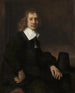 van een jonge man zittend aan een tafel, mogelijk Govaert Flinck - Rembrandt van Rijn — weergave van het kunstwerk