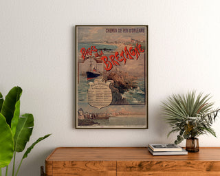 Vintage Brittany poster – Brittany Beaches, Orléans, framed above a wooden dresser, between plants.
