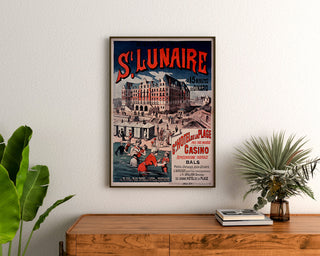 Vintage Brittany poster – Saint-Lunaire sea baths, framed above a wooden dresser between plants.