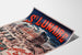 Vintage Brittany poster – Saint-Lunaire sea baths, shown on a curled sheet, perspective view.