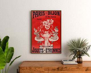 Vintage advertising poster Paris–Dijon, toys and holiday gifts, framed above a wooden dresser between plants.
