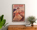 Reclameposter vintage Paris-Niort, zomernieuws, ingelijst boven een houten dressoir, tussen planten.