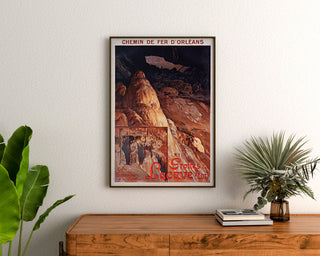 Vintage tourist poster – Grottes de Lacave, Rocamadour framed above a wooden dresser between plants.
