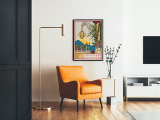 Vintage wine poster – Au bon vin d’Alsace – Hansi, framed in a living room with an orange armchair and a floor lamp.
