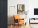 Vintage wine poster – Au bon vin d’Alsace – Hansi, framed in a living room with an orange armchair and a floor lamp.