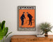 Vintage poster A Brace of Partridges, Strand Theatre, framed above a wooden dresser, flanked by plants.