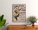 Vintage Angers Mid-Lent poster, framed above a wooden chest of drawers, between plants.
