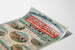 Vintage poster Auvergne, excursions PLM, gepresenteerd op een licht gebogen blad, perspectiefweergave.