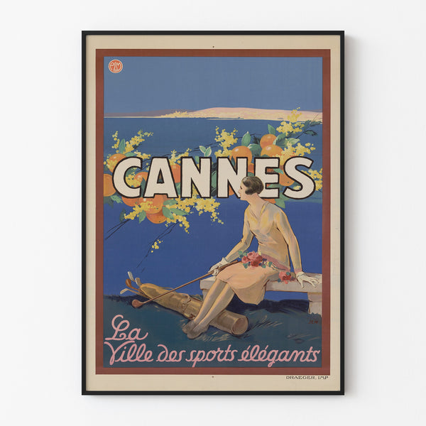 Vintage Cannes poster, Les Sports Élégants, displayed in a slim frame on a light wall.