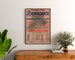 Vintage affiche Fort-de-France, liefdadigheidsfeest, ingelijst boven een houten dressoir, tussen planten.