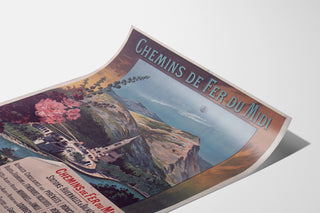 Vintage Lourdes seaside poster shown on a curved sheet, viewed in perspective.