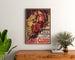 Vintage poster Saint-Cloud, patronal festival, framed above a wooden dresser, between plants.