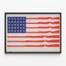 Reimagined American flag poster with weapons and airplanes — framed artwork on a wall