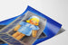 Vintage reclameposter Uvesterol met pop in doos